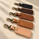 Grecorium rectangular leather keychains in five colours on ivory linen