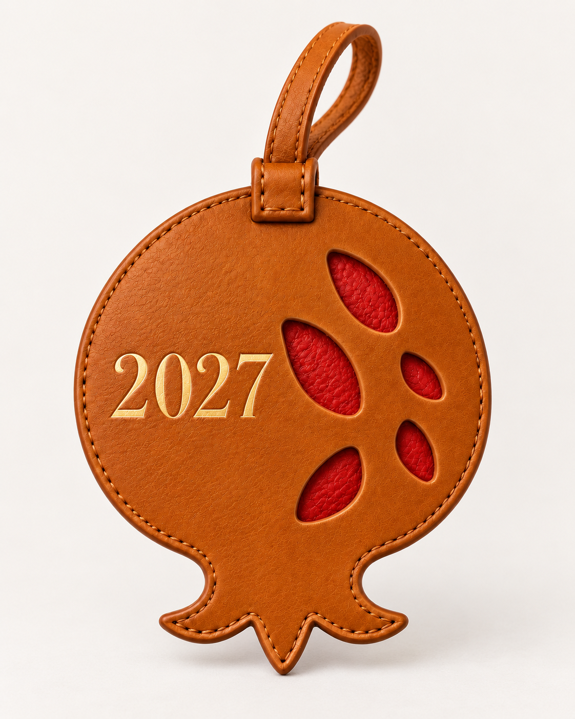 Grecorium leather pomegranate lucky charm with gold-debossed 2027 detail