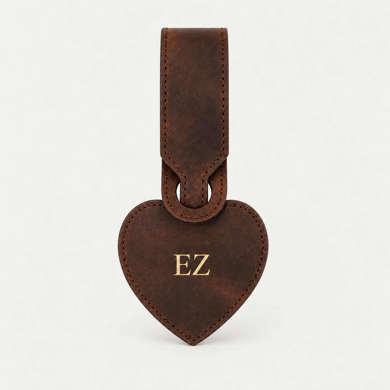 Heart Luggage Tag — Grecorium leather accessory on a neutral background