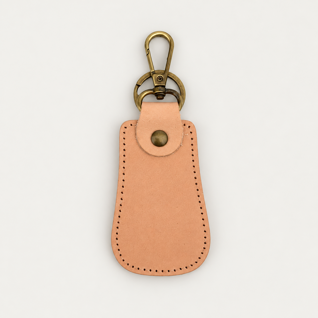 Pear Shape Keychain No. 2 — Grecorium leather accessory on a neutral background