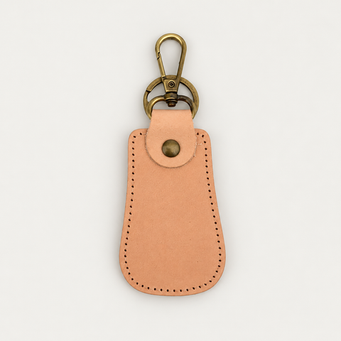 Pear Shape Keychain No. 2 — Grecorium leather accessory on a neutral background