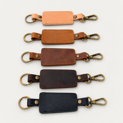 Bell Keychain — Grecorium leather accessory on a neutral background