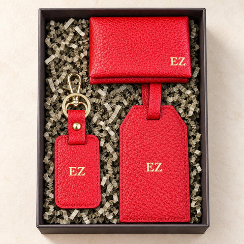 Gift box containing the personalised red vegan leather cardholder, luggage tag and keychain