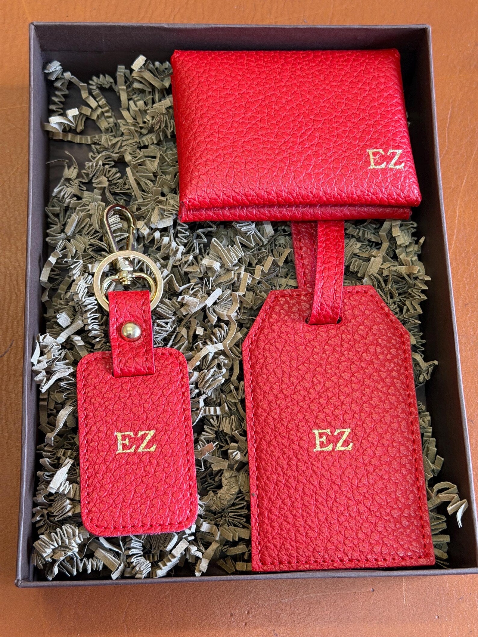 Red vegan leather gift set with gold foil initials in its gift box