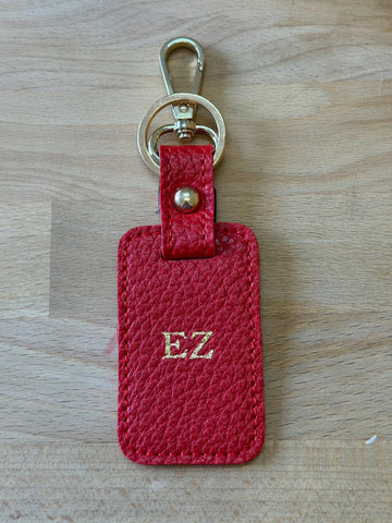 Red rectangular personalised keychain with gold-tone clasp and ring