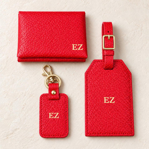 The three matching red vegan leather accessories displayed together