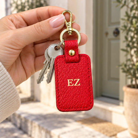 Personalised red keychain shown with keys